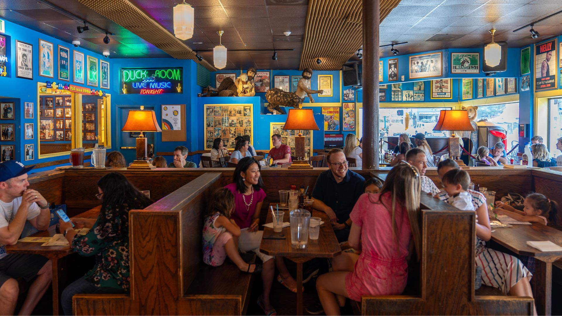 Families enjoy food among the memorabilia of Blueberry Hill.