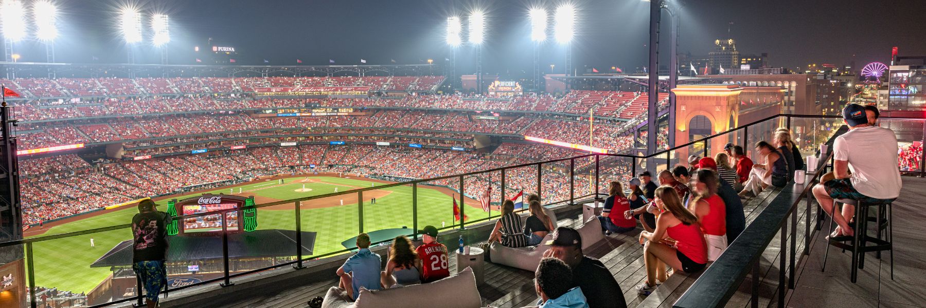Sports fans watch a St. Louis Cardinals game at Busch Stadium.