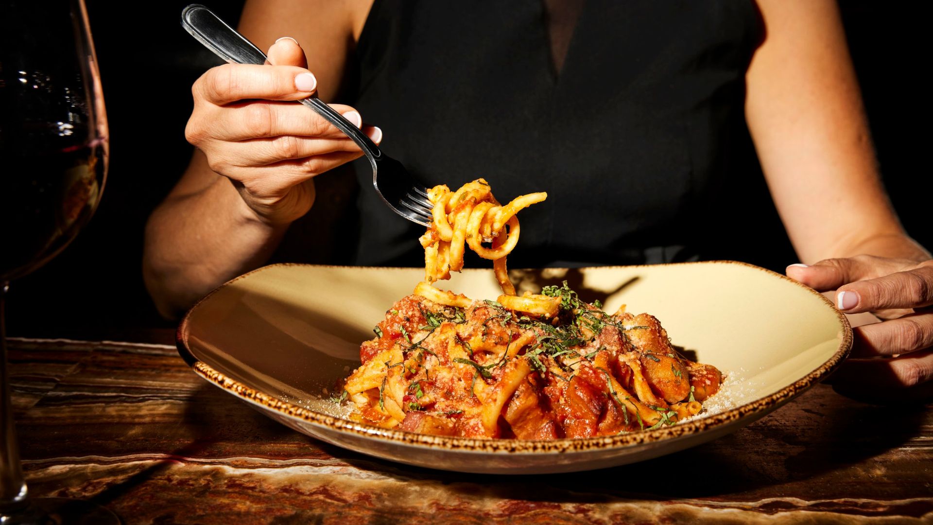 A patron digs into housemade pasta at Charlie Gitto's on The Hill.