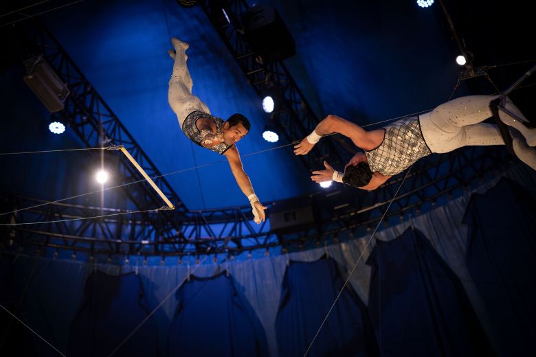 Aerial acrobats fly through the air at Circus Flora under The Big Top in St Louis.