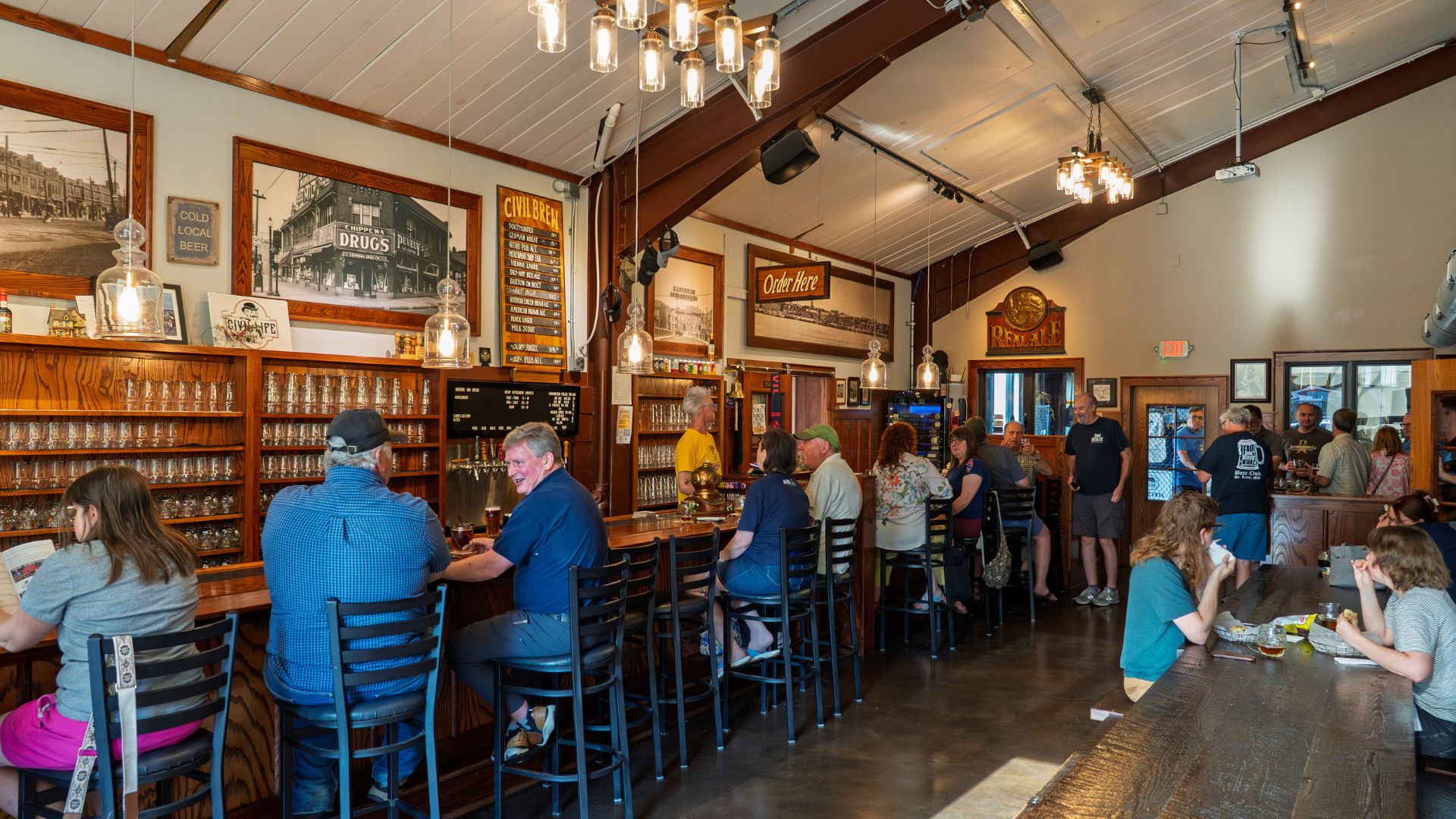 People enjoy beer and bar food at Civil Life Brewing Co, one of the best St Louis breweries.
