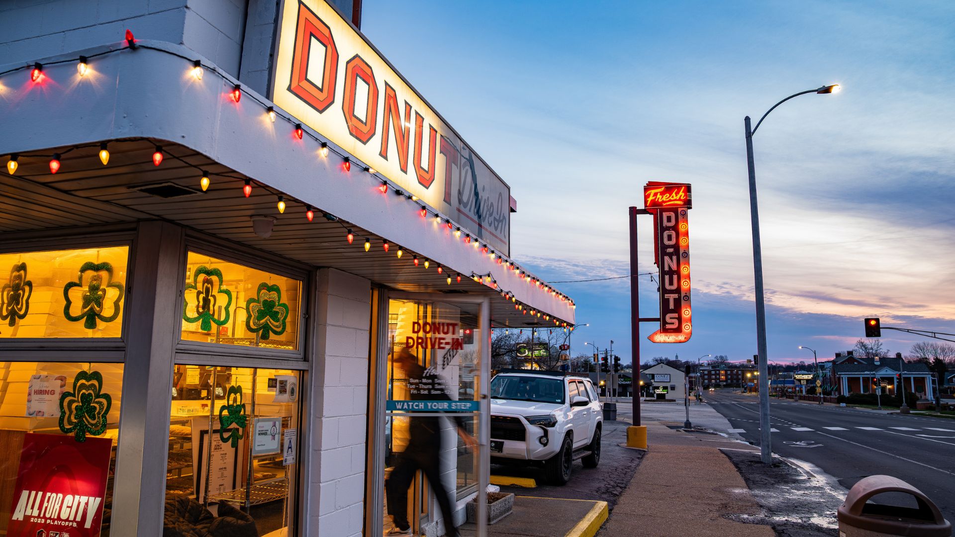 Hungry customers enter Donut Drive-In when it opens.