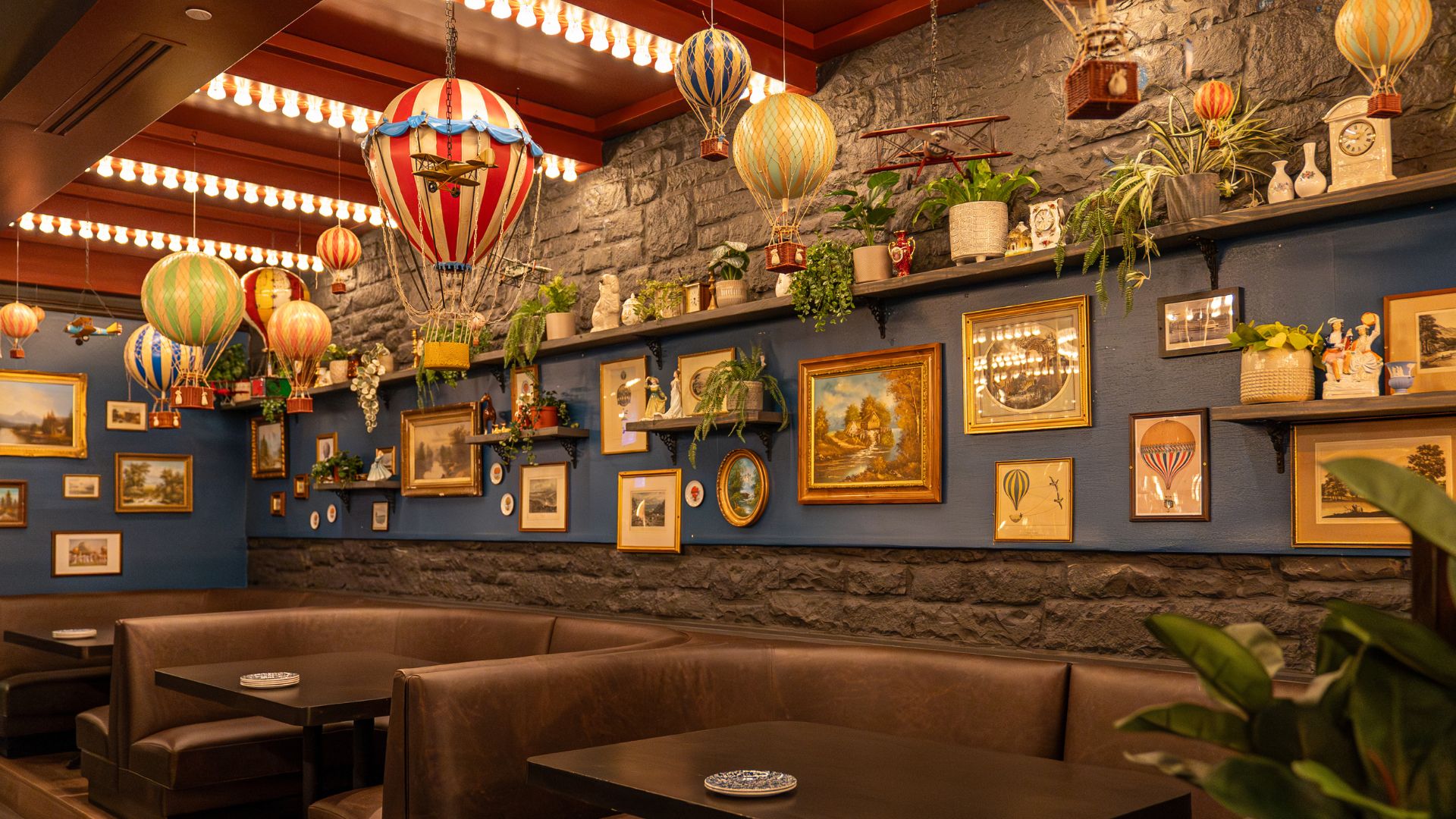 A new social darts bar in St Louis has whimsical décor like vintage hot air balloons.
