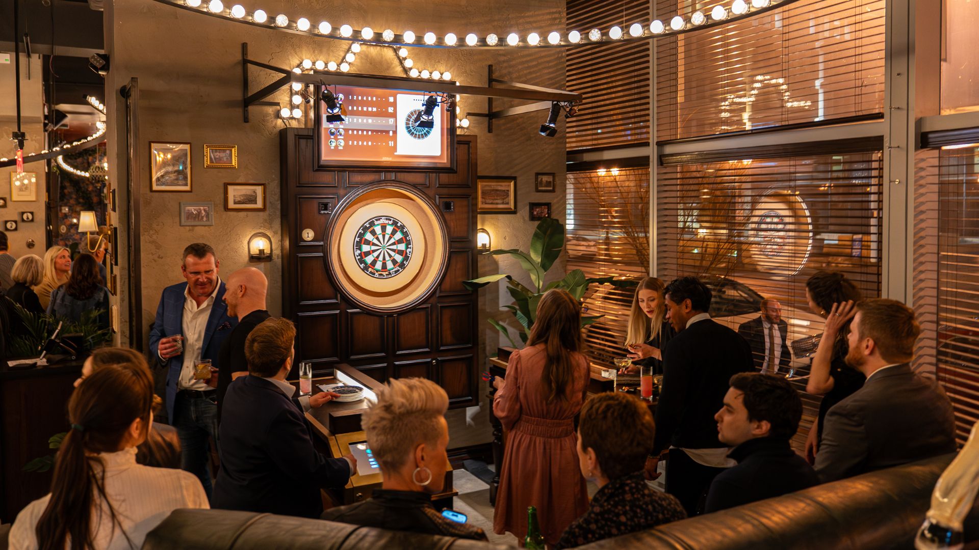 A group of gamers play darts at Flight Club in Clayton, one of the most unique St Louis event venues.