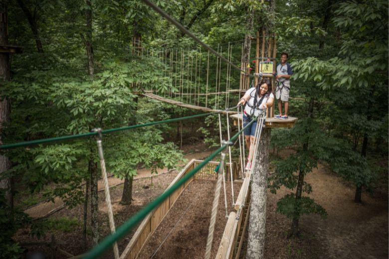 A mother and son tackle a high-ropes course in Creve Coeur Park in St Louis.
