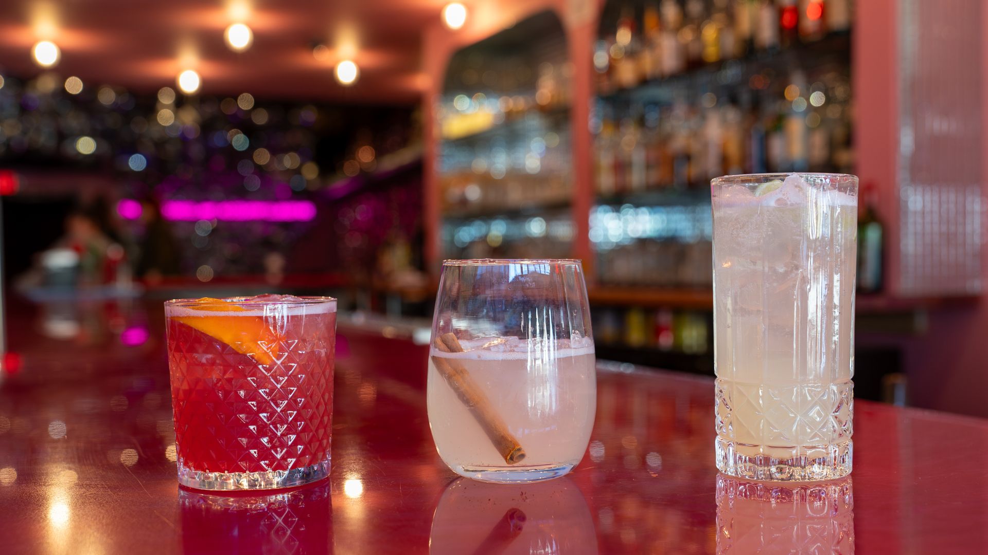 Hidden Gems serves pink cocktails to match its pink interior.