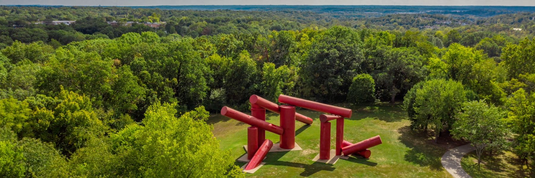 The Way, an outdoor sculpture at Laumeier Sculpture Park, features giant red cylinders.