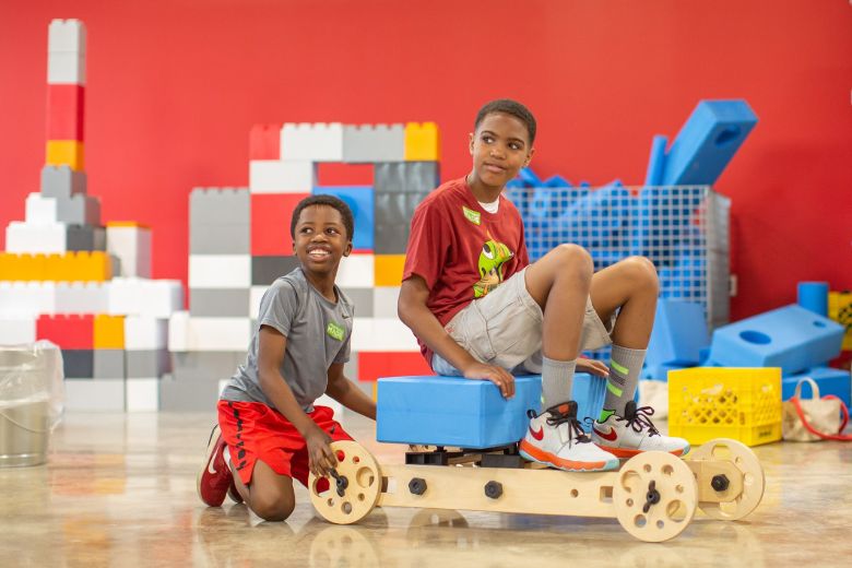 Two boys get crafty at MADE for Kids created by The Magic House.