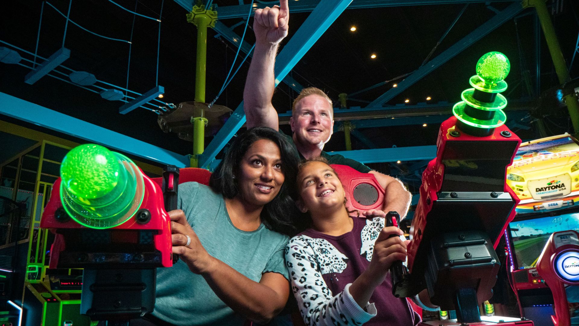 A family plays a game at Main Event in Chesterfield.