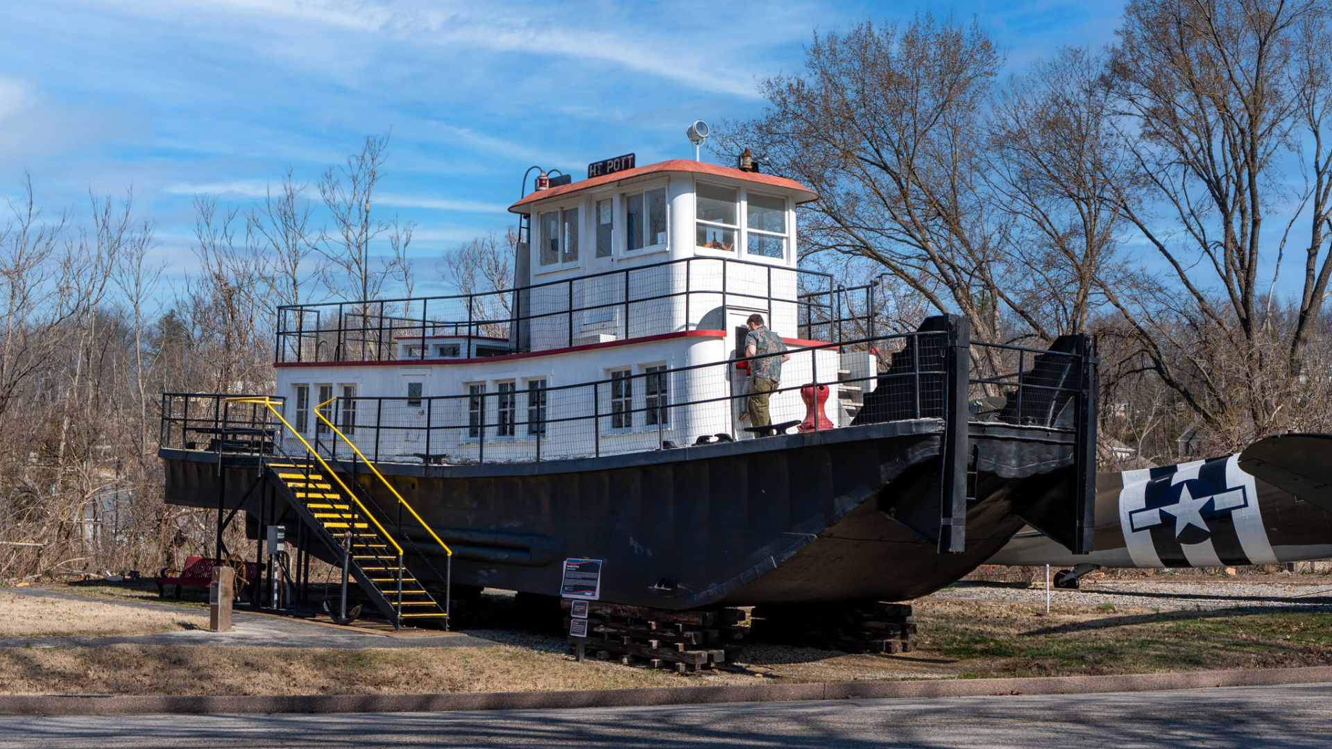 Visitors walk the decks of the H.T. Pott, the first Missouri River towboat with a welded steel hull rather than a riveted one.