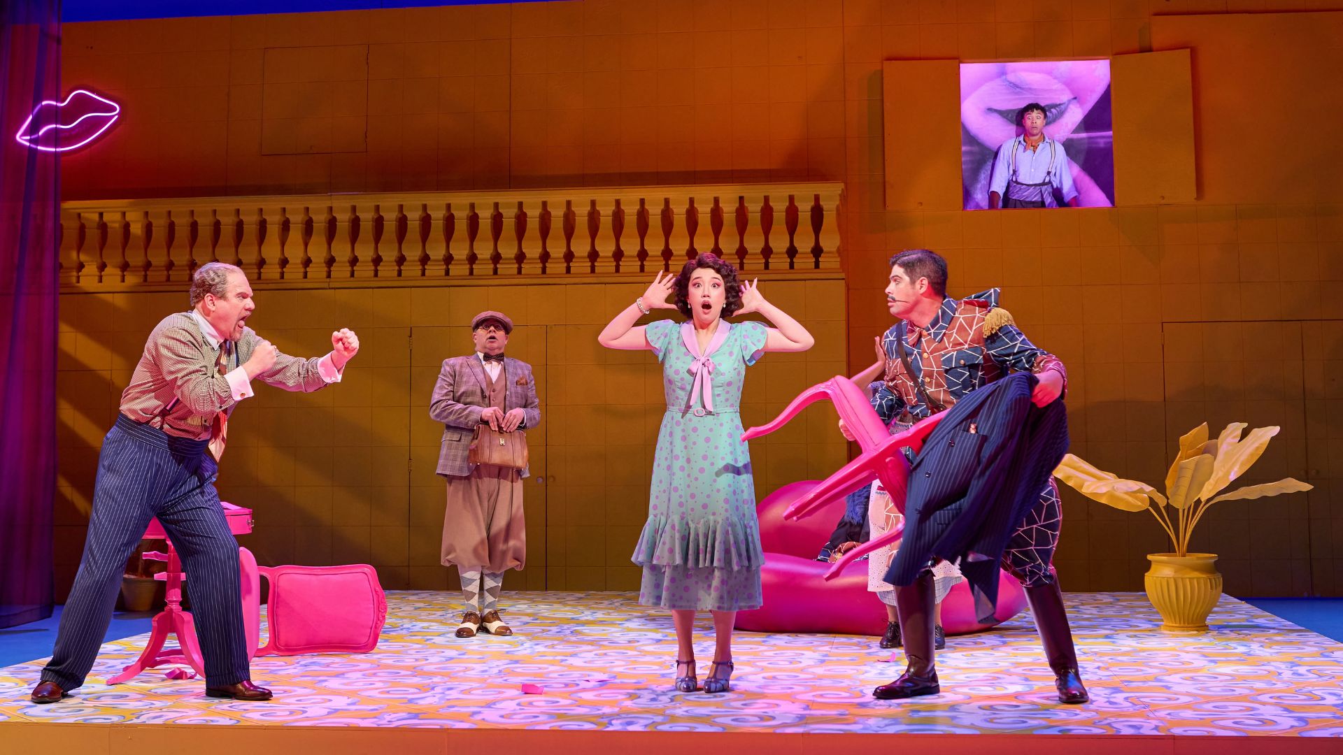 The cast of The Barber of Seville acts out a dramatic scene.