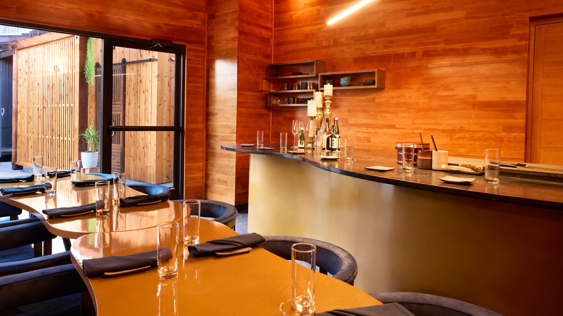 The custom-built, glass-enclosed pavilion at Sado serves an omakase-style dinner.