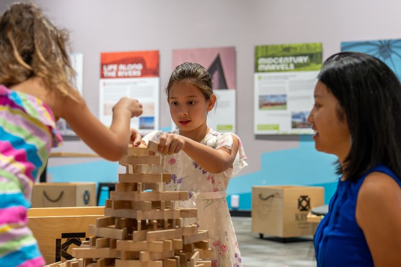 People play with building blocks at the Saint Louis Science Center.