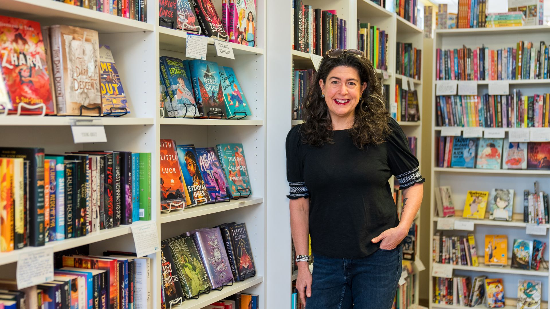 Holland Saltsman, owner of The Novel Neighbor, poses in the bookstore.