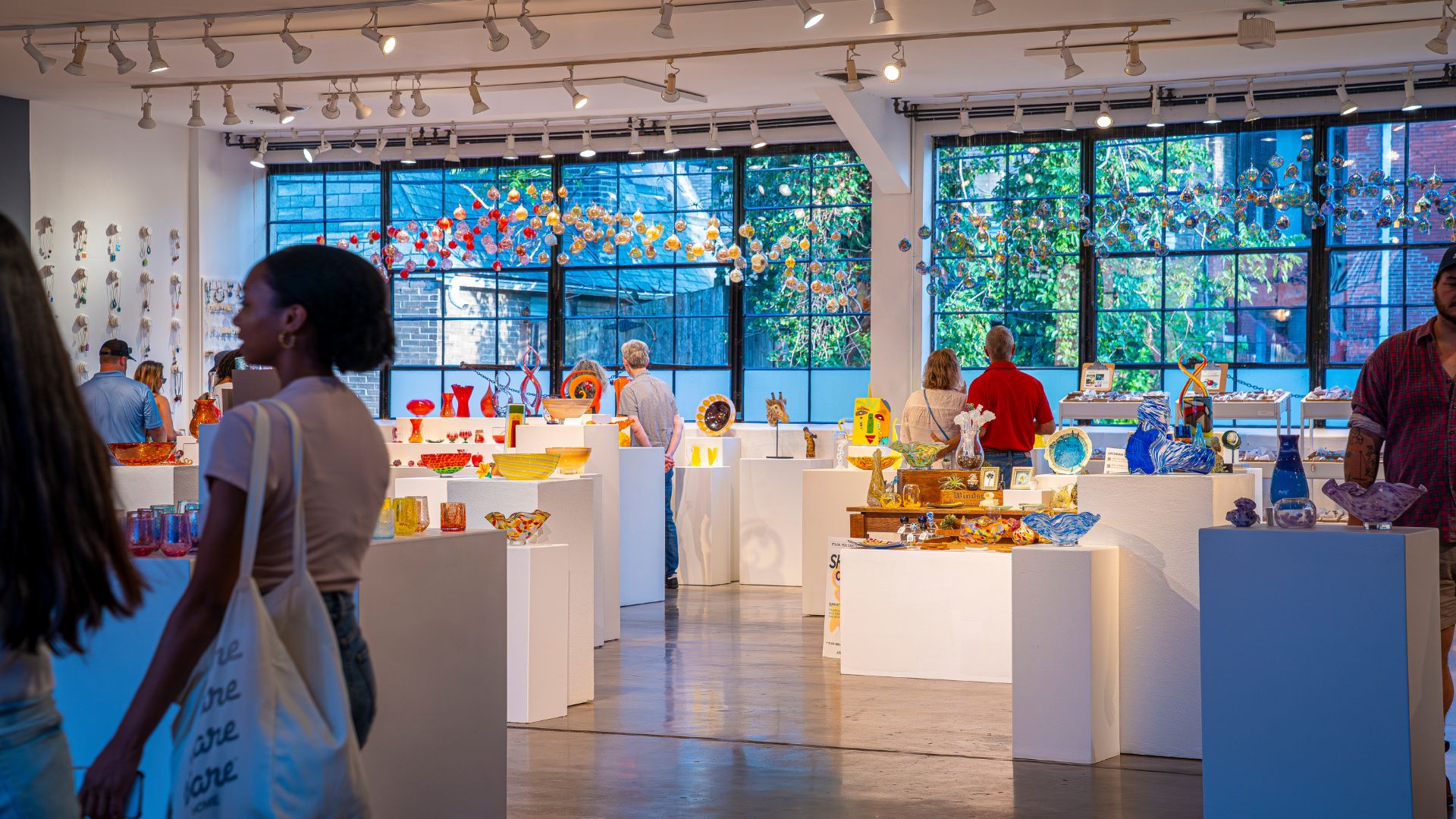 People shop for glass art at Third Degree Glass Factory in St Louis.