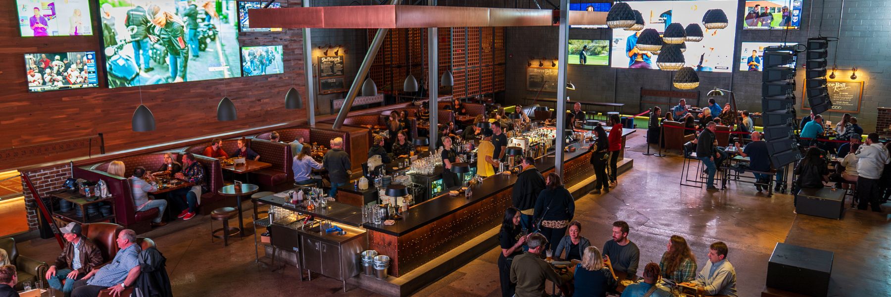 People mill about the bar at Westport Social in St. Louis.
